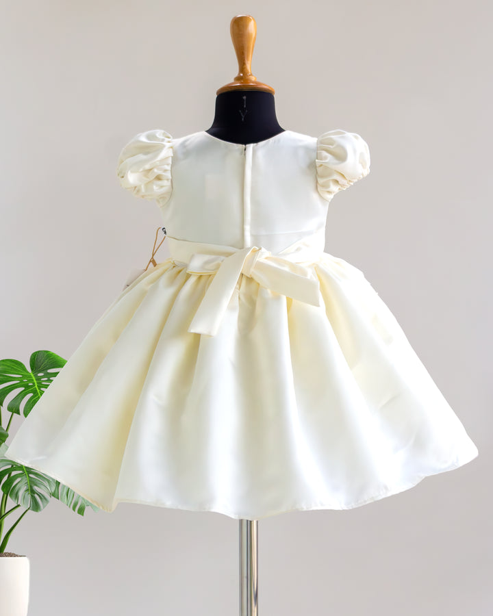 Off white satin jungle theme frock detail shot – Stanwells Kids