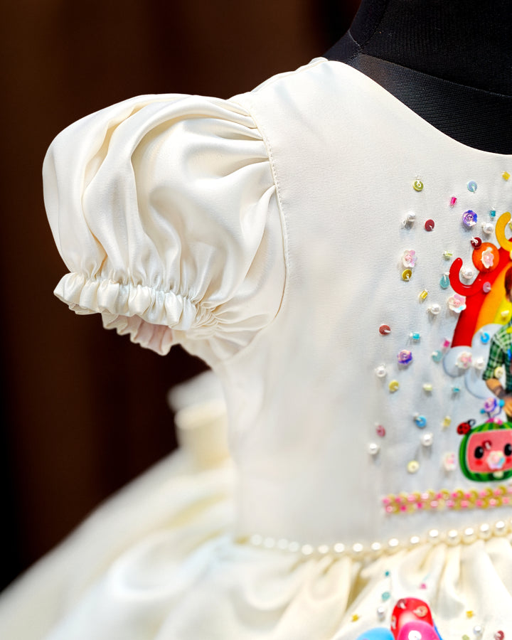 Off white Cocomelon theme birthday frock side view for baby girl – Stanwells Kids