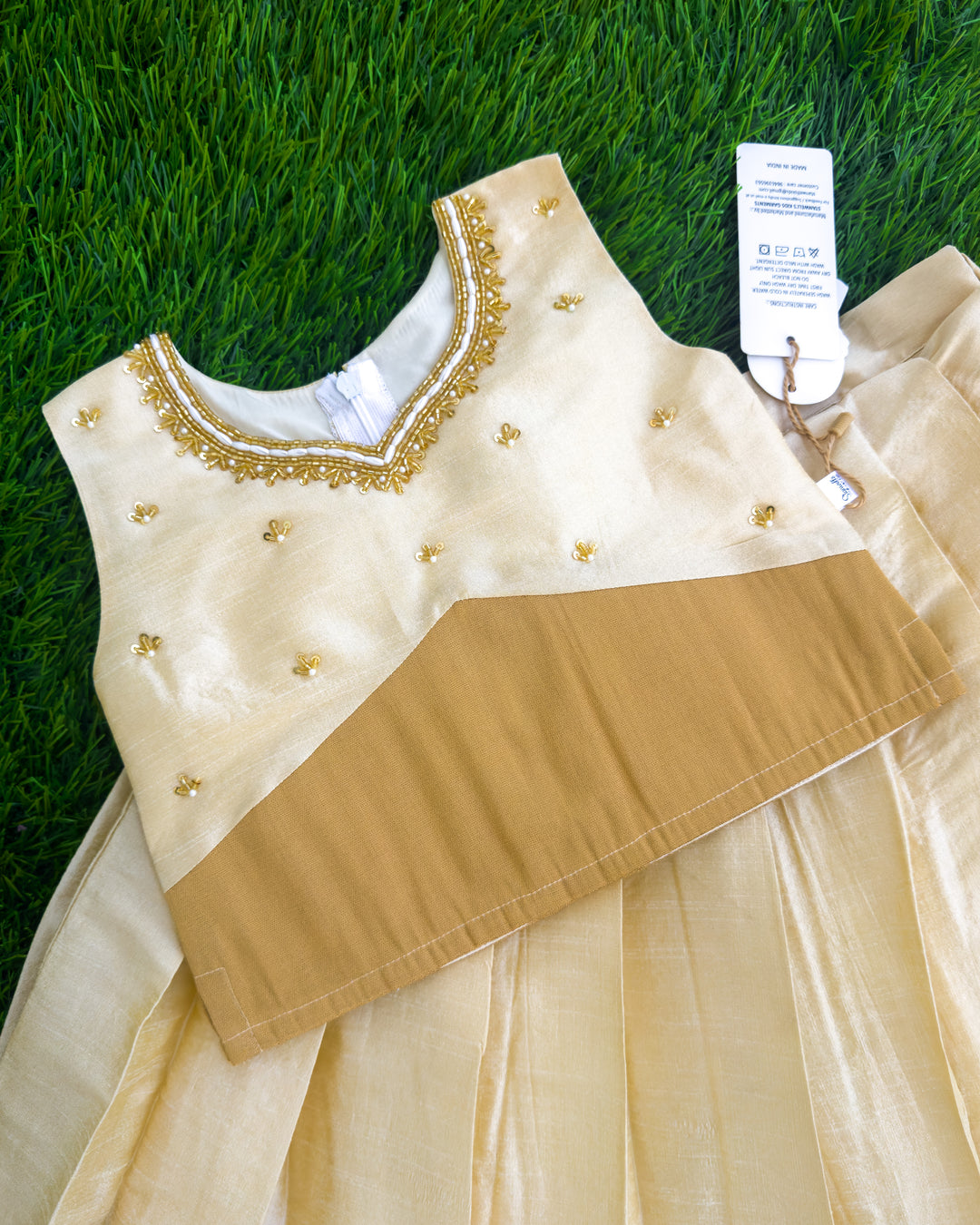 Golden Kasavu handwork detail on cream silk lehenga choli for Onam – Stanwells Kids