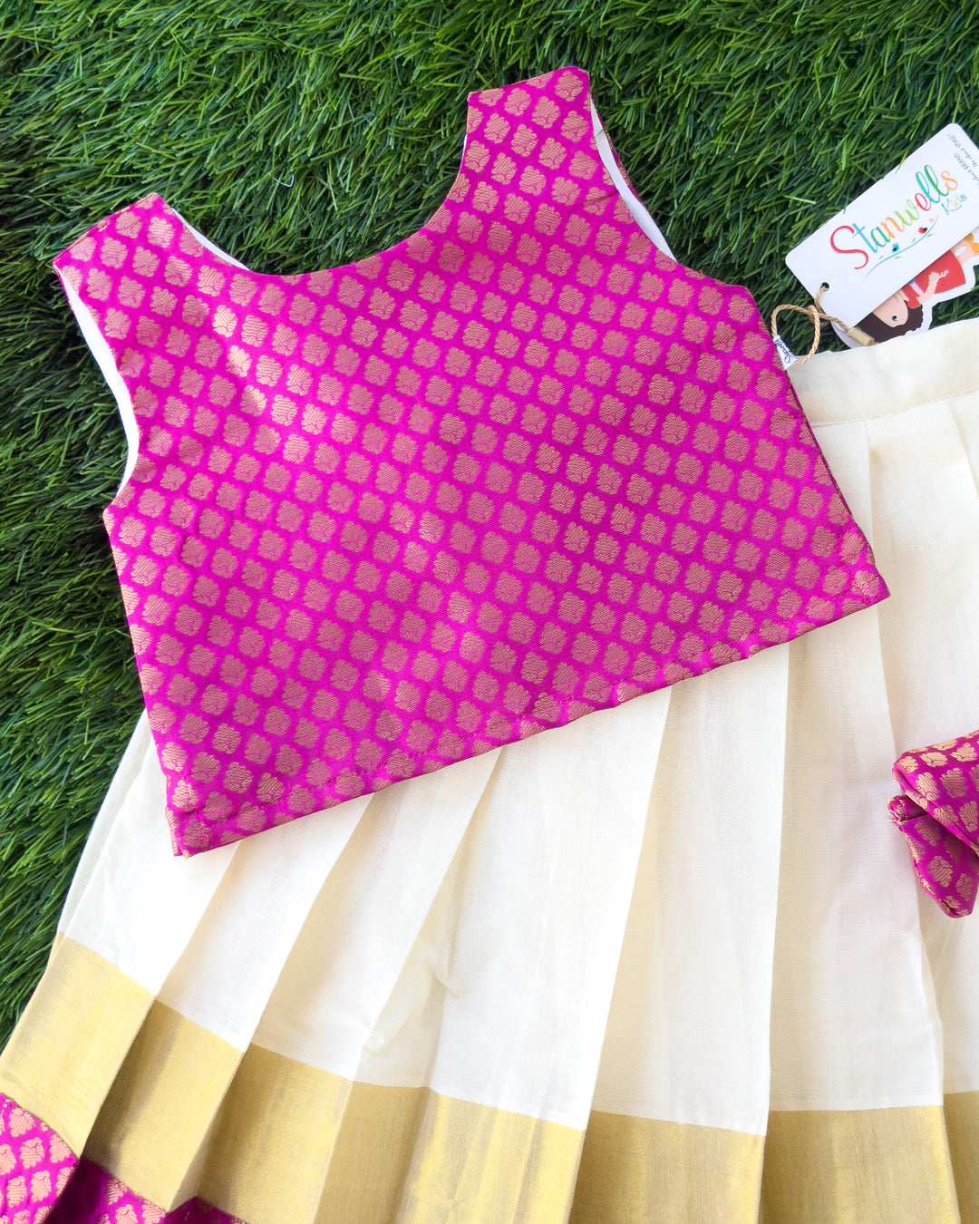 Magenta brocade blouse with Kerala Kasavu skirt for Onam, Stanwells Kids