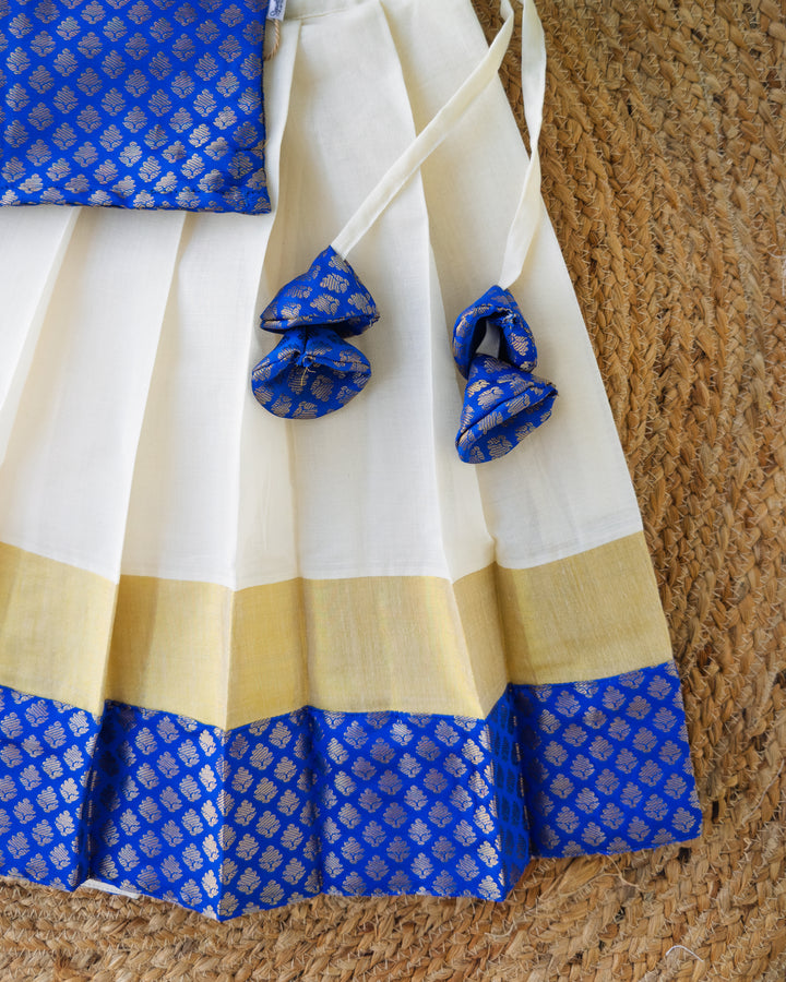 Back bow detail on cream royal blue Kasavu lehenga for girls, Stanwells Kids