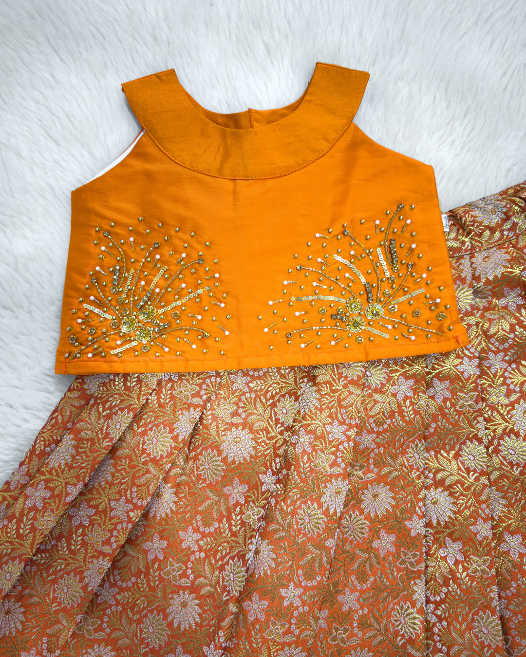 Golden bead handwork yoke detail on orange brocade lehenga blouse – Stanwells Kids