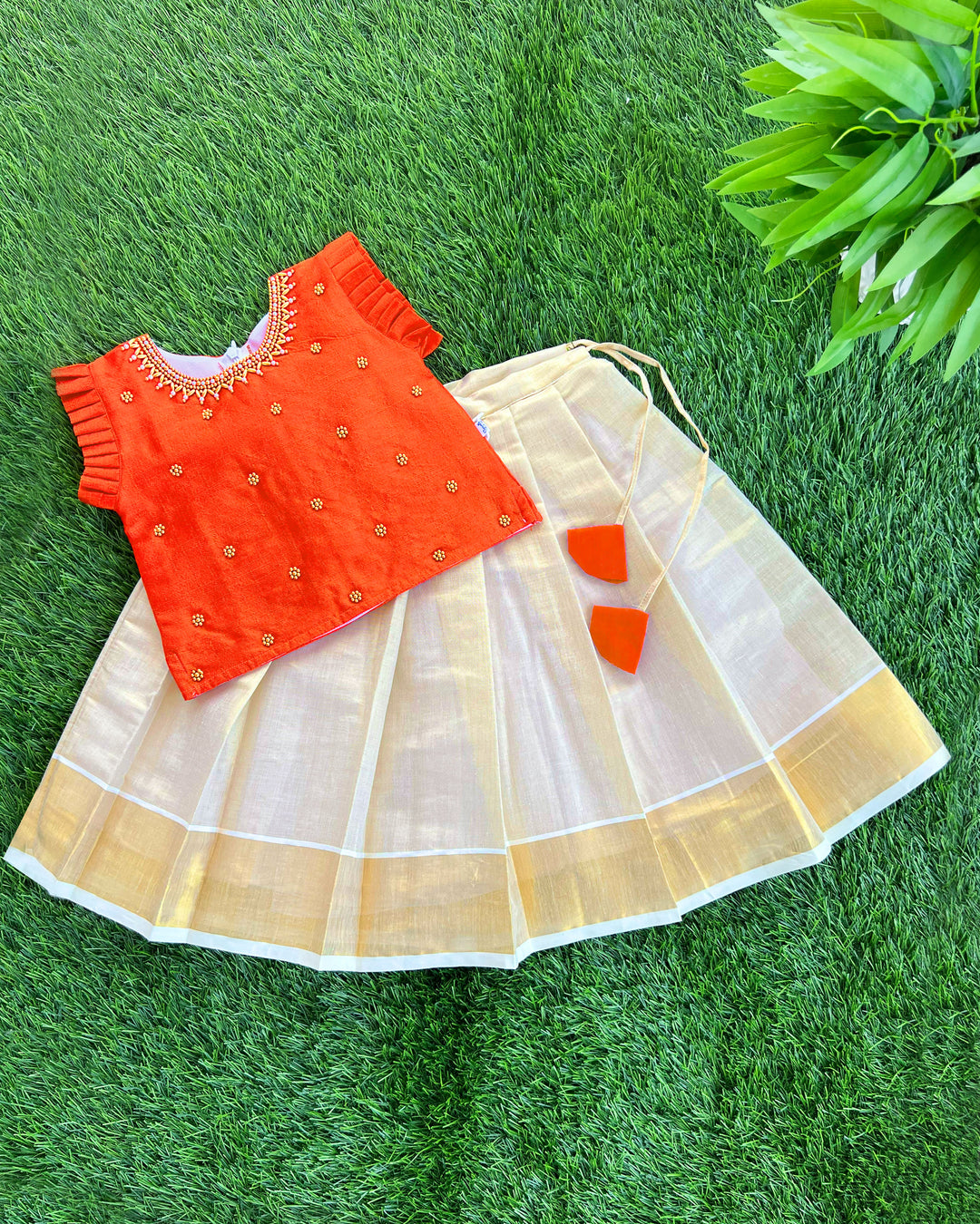 Baby girls traditional birthday dress – orange & gold Kerala Kasavu Lehenga Choli with handwork