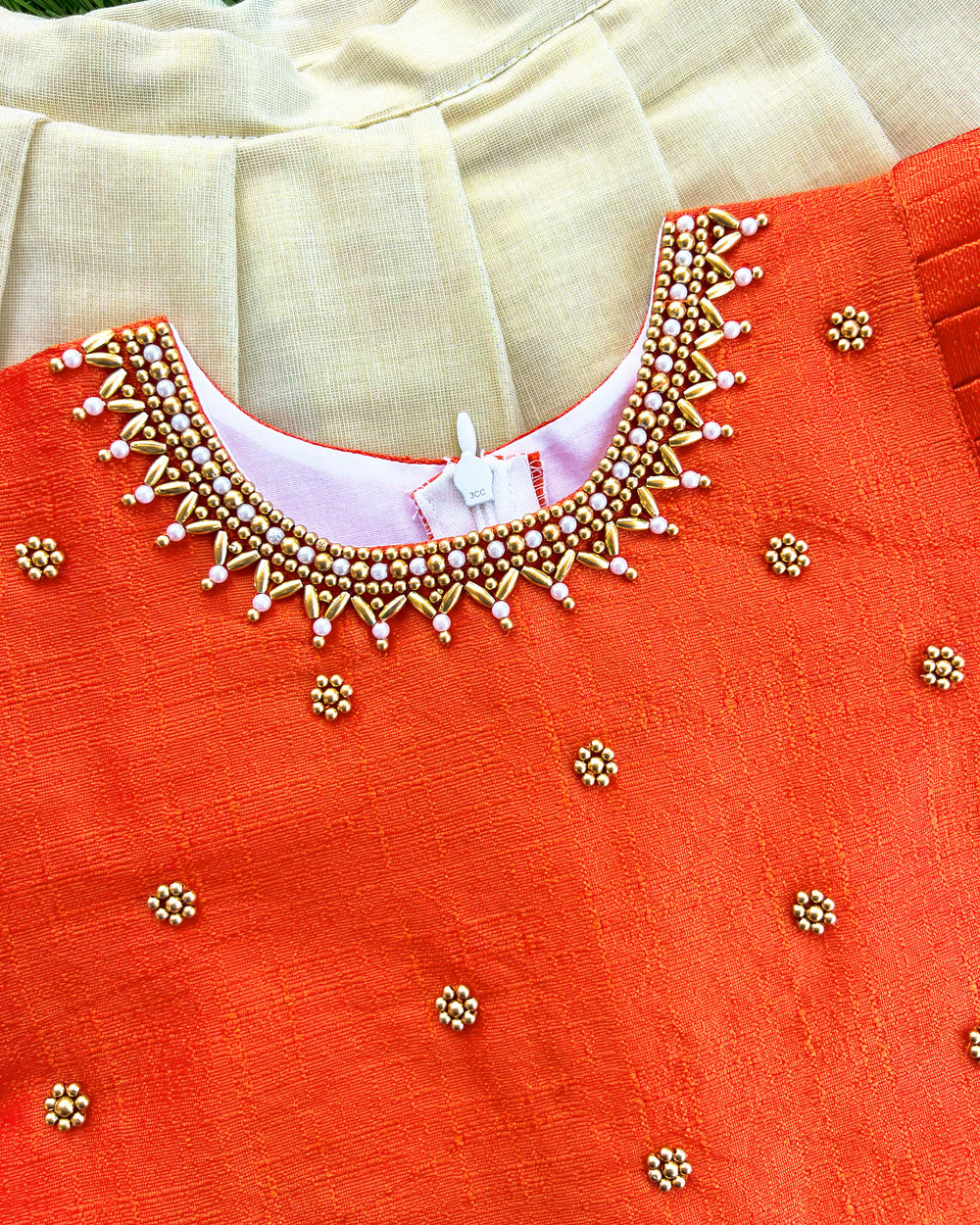 Baby girls traditional birthday dress – orange & gold Kerala Kasavu Lehenga Choli with handwork