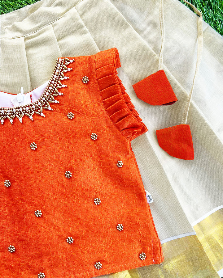 Baby girls traditional birthday dress – orange & gold Kerala Kasavu Lehenga Choli with handwork