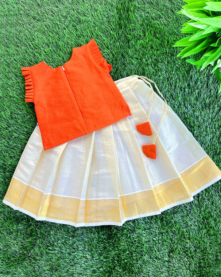 Baby girls traditional birthday dress – orange & gold Kerala Kasavu Lehenga Choli with handwork