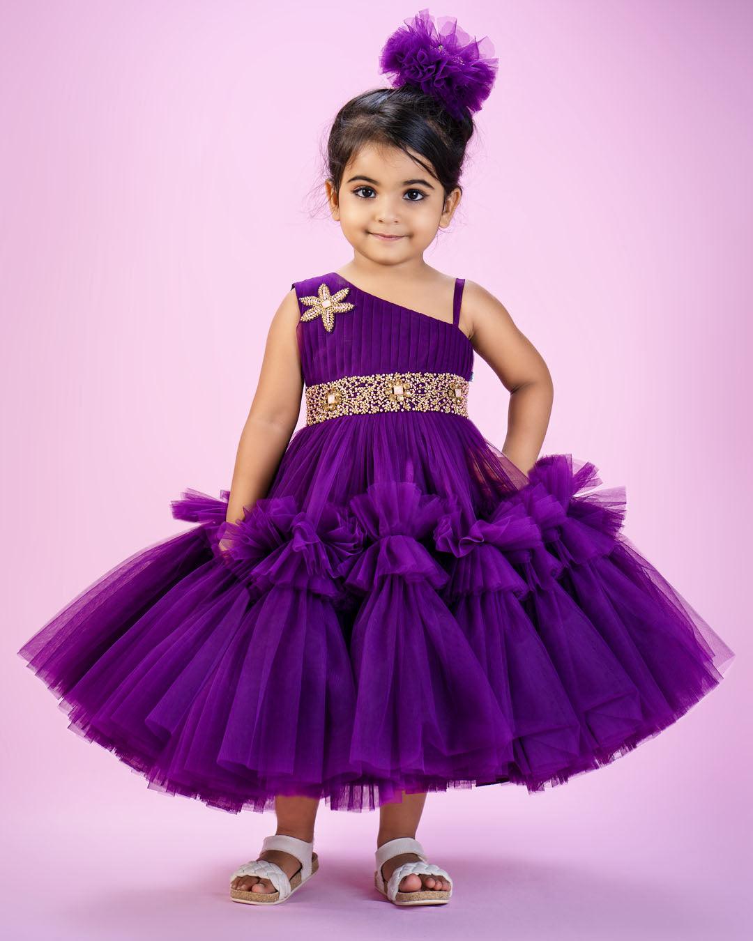 Purple Shade Pleated Ruffled Frock
Material: Purple Shade Pleated Ruffled Frock mono net with layered and ruffles on the end portion. Yoke portion is designed with pleated pattern and a handwork in t