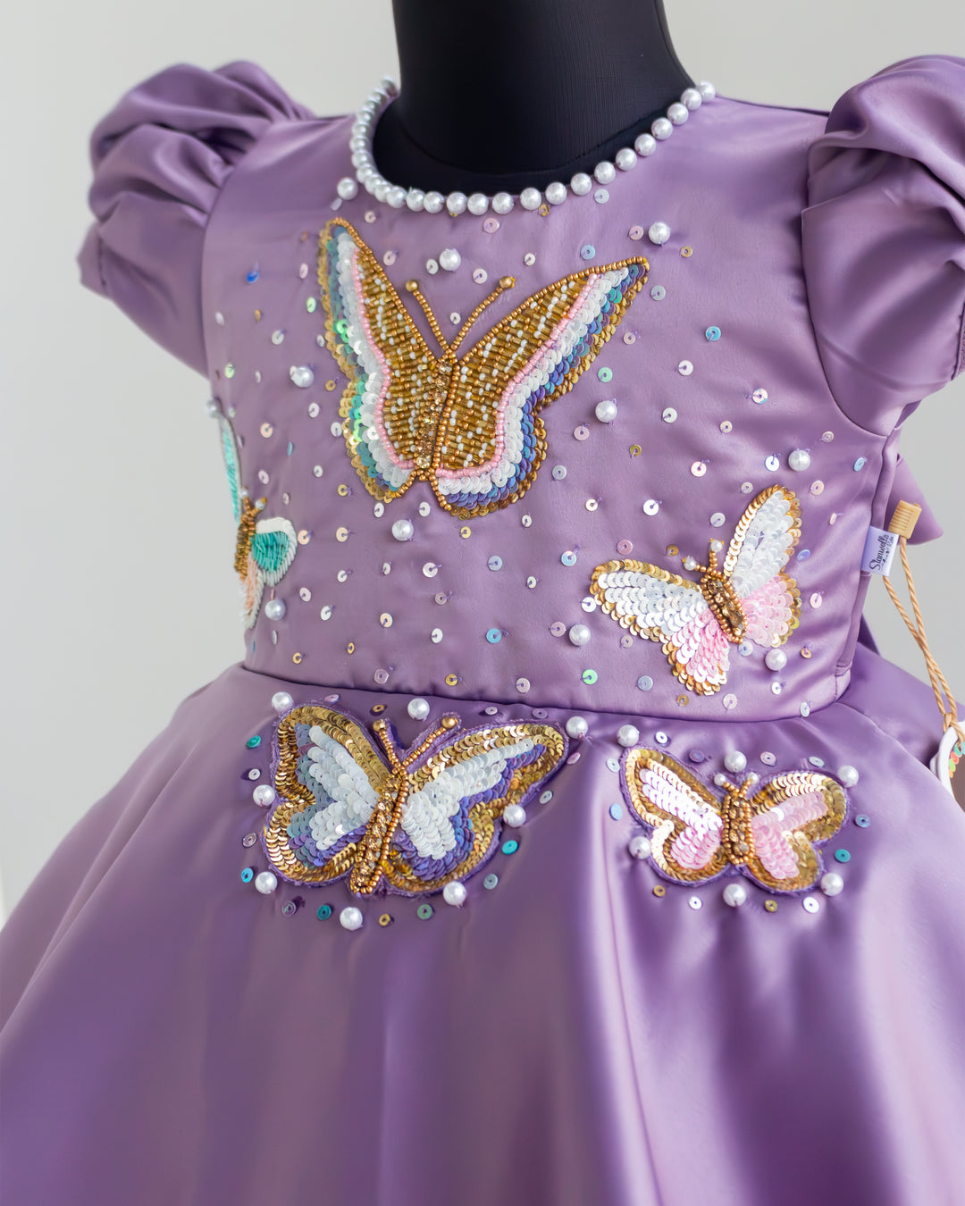 Butterfly applique detailing on pastel lavender silky satin birthday frock – Stanwells Kids