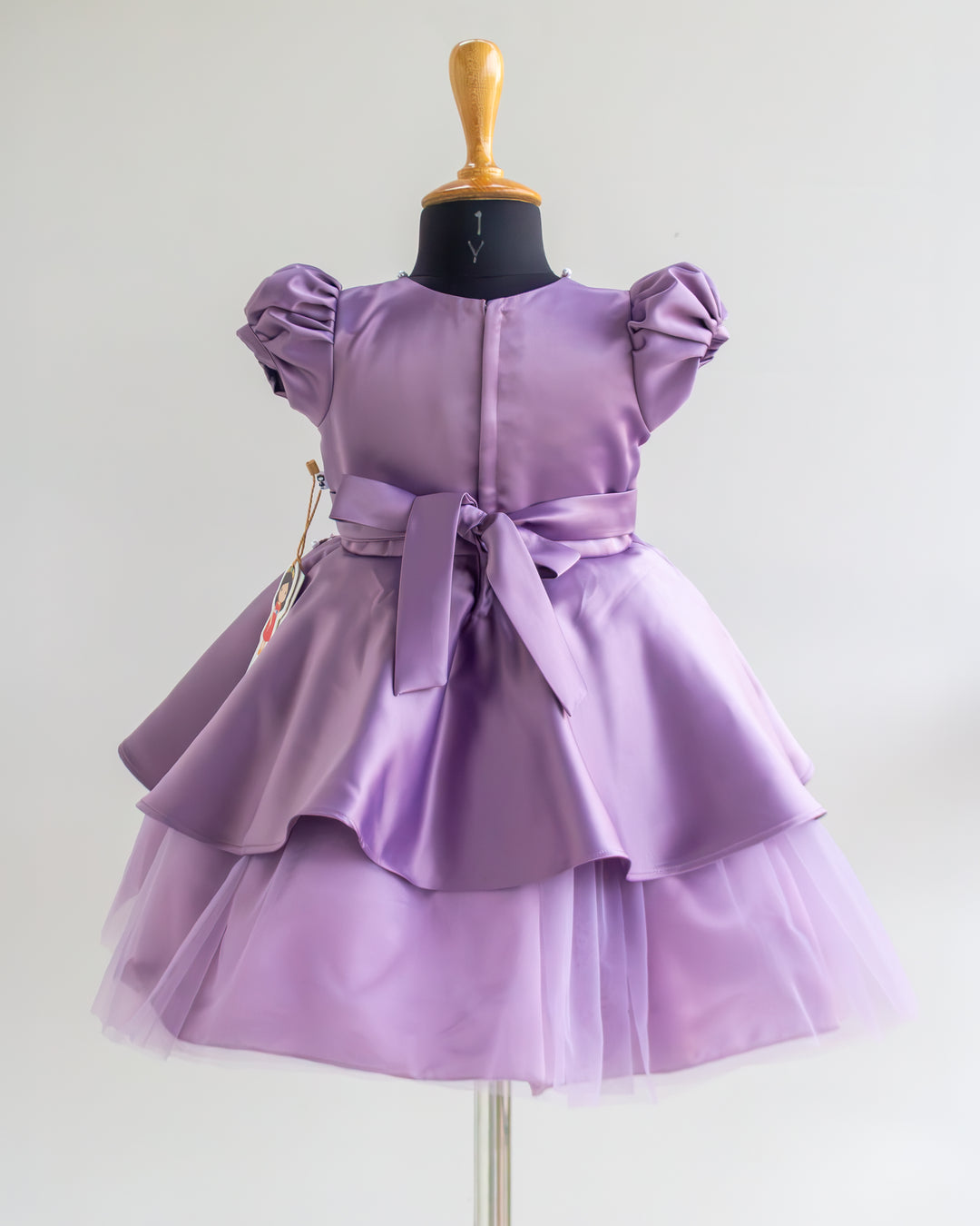 Back view of pastel lavender heavy butterfly satin partywear frock – Stanwells Kids