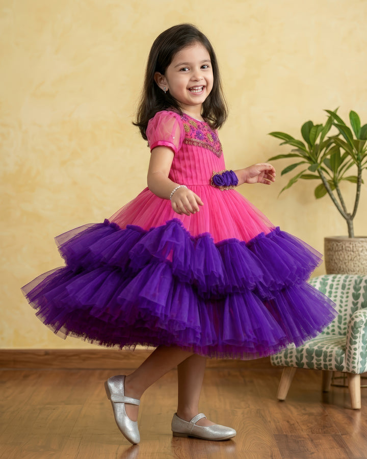 Peach &amp; Violet combo Handwork Ruffles Party wear Frock
Material: Peach colour nylon net material is used as pleated design in the yoke portion with Heavy quality ultra satin as the primary lining .This satin lining give