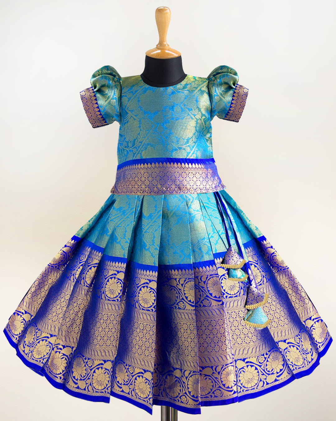 Peacock blue Banarasi silk lehenga choli for baby girls

Traditional puff sleeve dress for kids

Banarasi silk birthday dress for girls

Baby girls ethnic wear lehenga

Festive partywear dress for toddlers

Peacock blue traditional frock for baby girls

Stanwells Kids Banarasi birthday collection