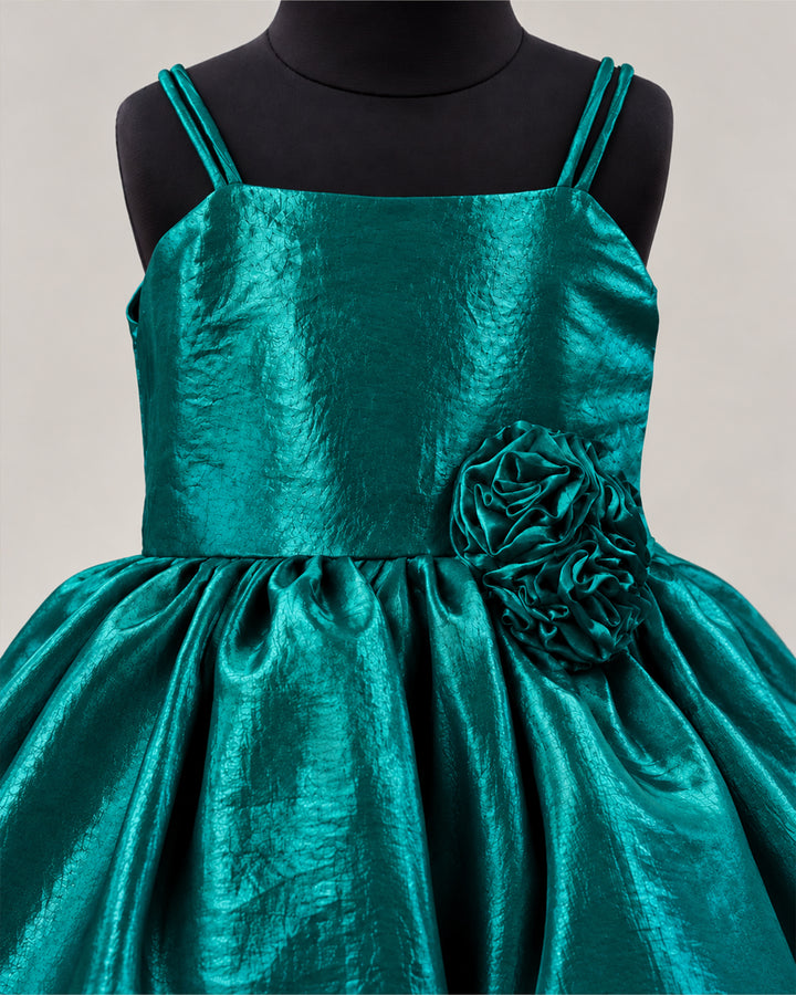 Close-up view of the bodice detailing on a premium peacock green velvet organza frock for baby girl.