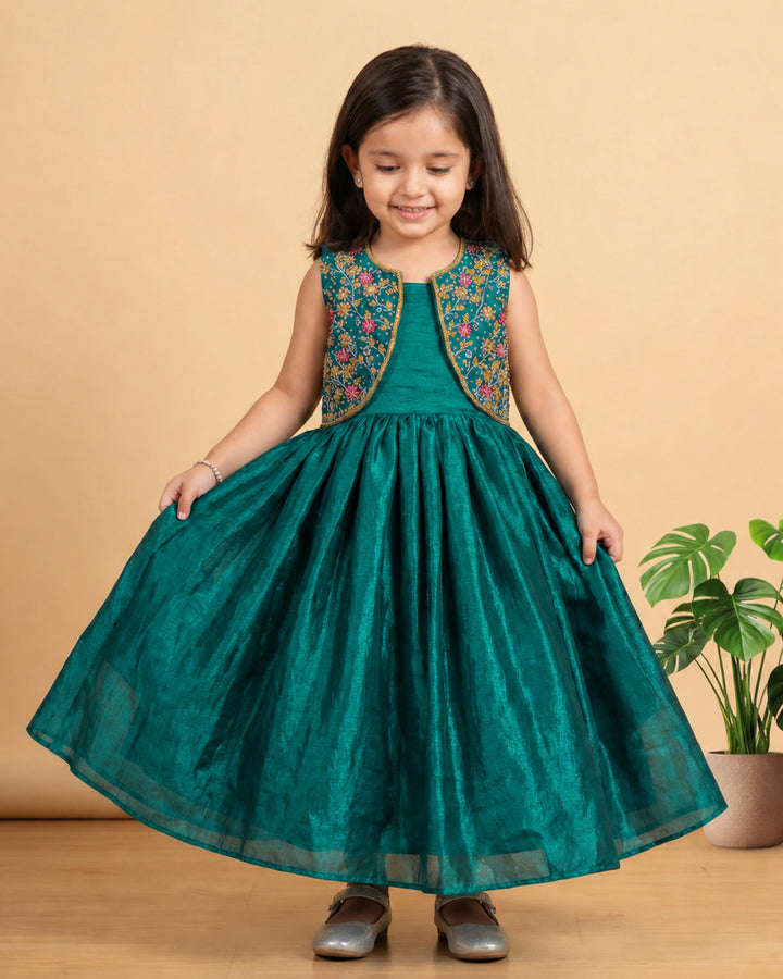 Full-length peacock green ethnic jacket gown for baby girl, perfect for birthday parties, weddings, and festive occasions.