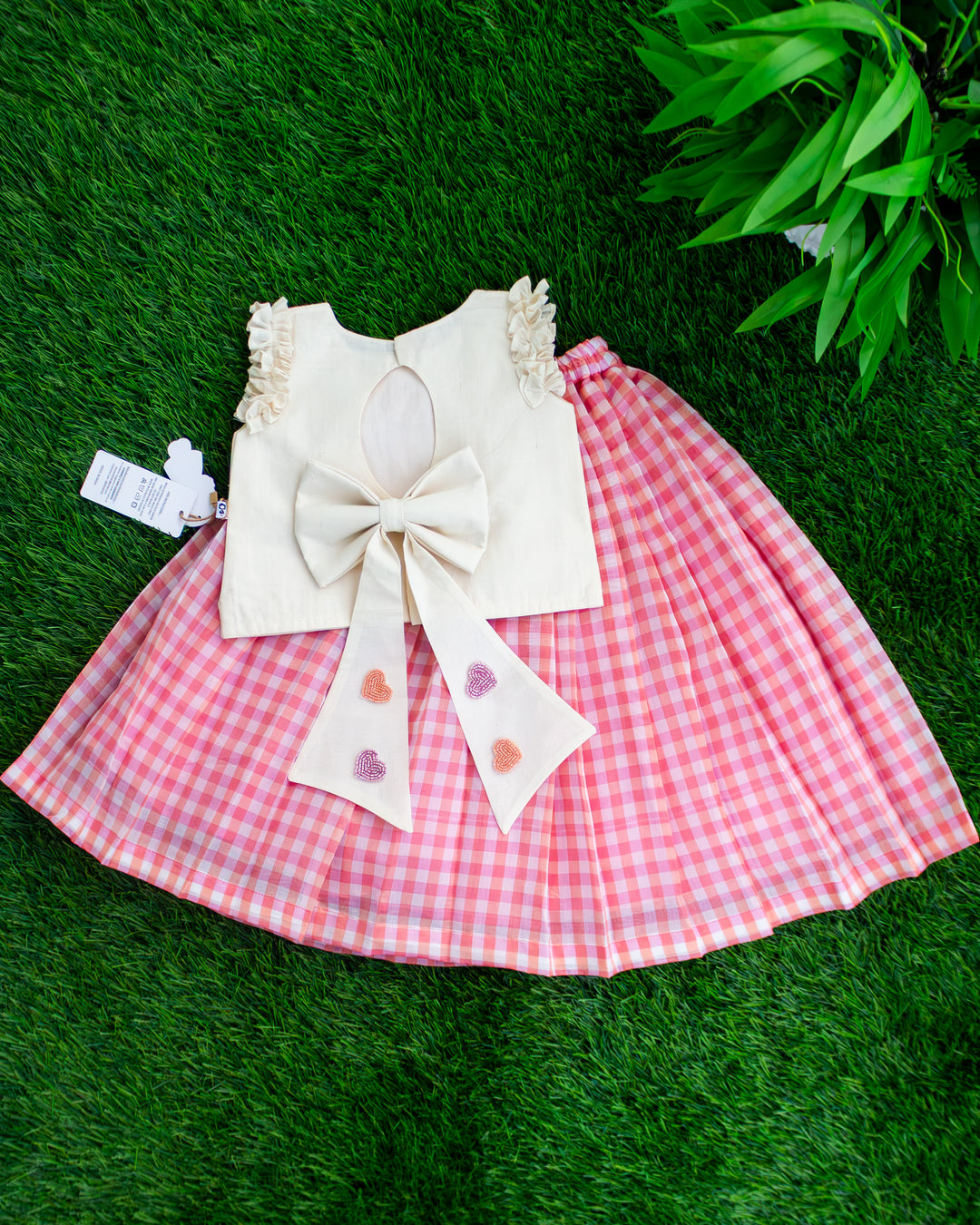 Ruffled sleeves and pleated check skirt on pink cream lehenga choli – Stanwells Kids