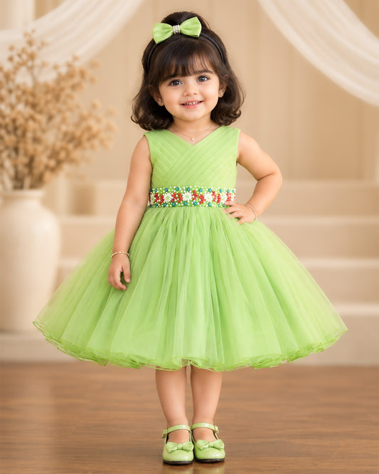 Pista green pleated sleeveless frock for baby girl with elegant handwork detailing by Stanwells Kids, perfect for birthdays, parties, and special occasions.