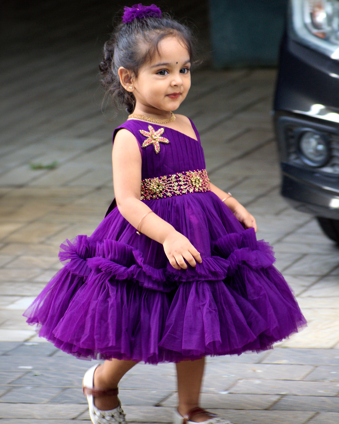 Purple Shade Pleated Ruffled Frock
Material: Purple Shade Pleated Ruffled Frock mono net with layered and ruffles on the end portion. Yoke portion is designed with pleated pattern and a handwork in t