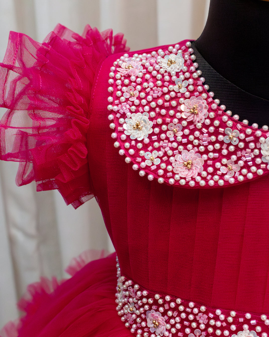 Rani pink birthday dress for baby girl with handwork

Baby girl partywear frock in rani pink shade

Peter collar pleated birthday dress for toddler girl

Rani pink baby girl frock satin lining back view

Handwork rani pink birthday dress close up detail

Baby girl first birthday partywear pink frock

Designer rani pink frock for baby girl celebration

Toddler girl birthday dress with pleated yoke