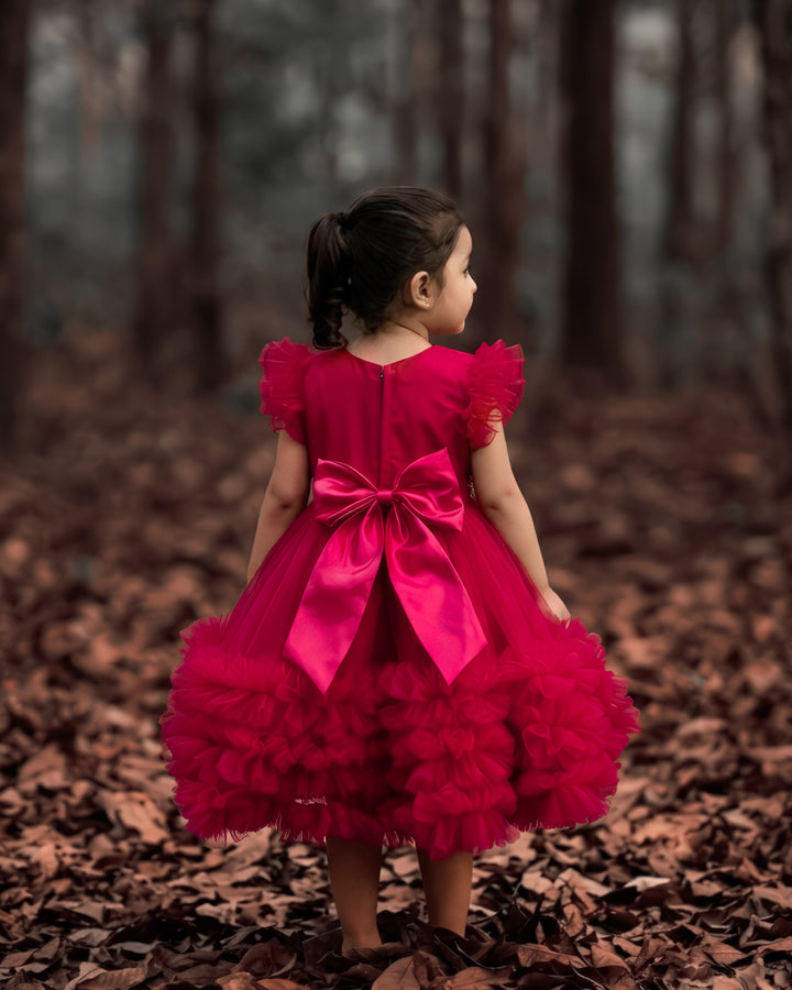 Rani pink birthday dress for baby girl with handwork

Baby girl partywear frock in rani pink shade

Peter collar pleated birthday dress for toddler girl

Rani pink baby girl frock satin lining back view

Handwork rani pink birthday dress close up detail

Baby girl first birthday partywear pink frock

Designer rani pink frock for baby girl celebration

Toddler girl birthday dress with pleated yoke
