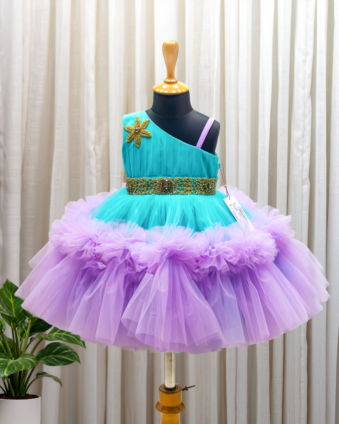 Sea green and lilac shade pleated partywear ruffles frock for baby girl – front view, Stanwells Kids