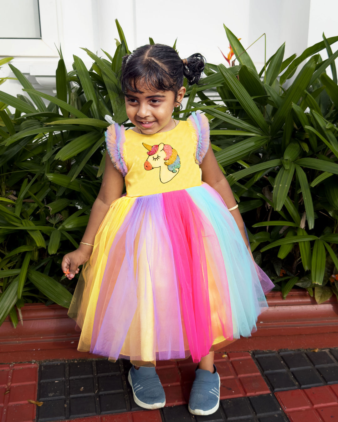 Rainbow unicorn multi-shade party wear frock for baby girls' birthday.