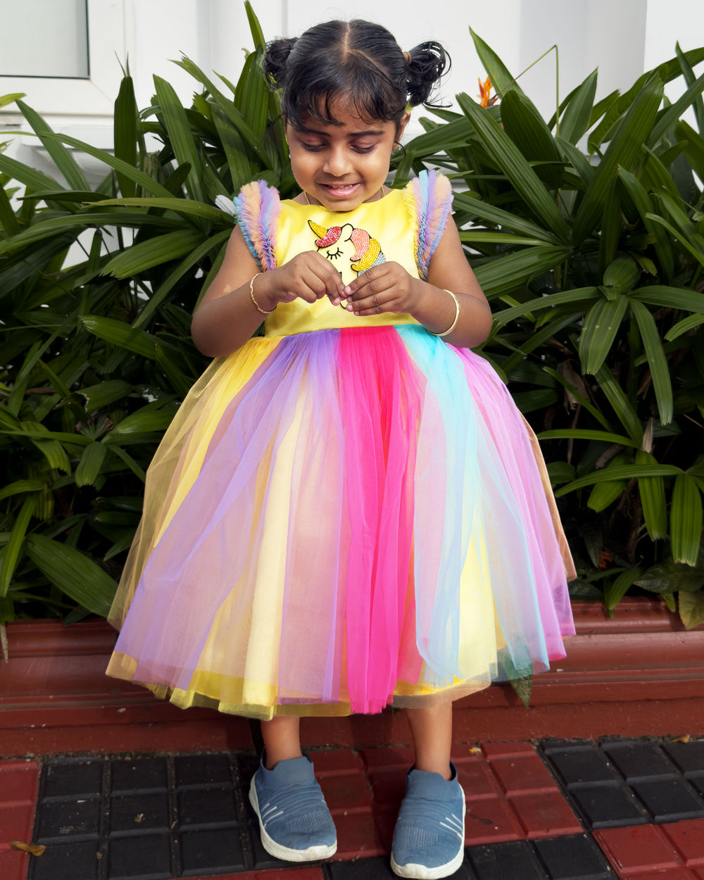 Rainbow unicorn multi-shade party wear frock for baby girls' birthday.