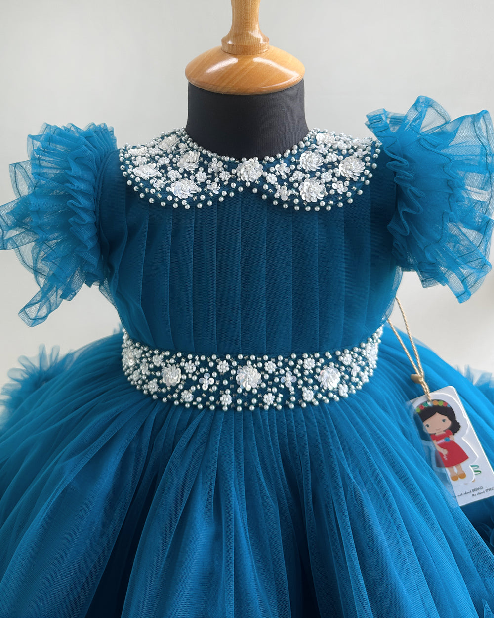 Handwork Peter Pan collar detail on teal blue birthday frock – Stanwells Kids