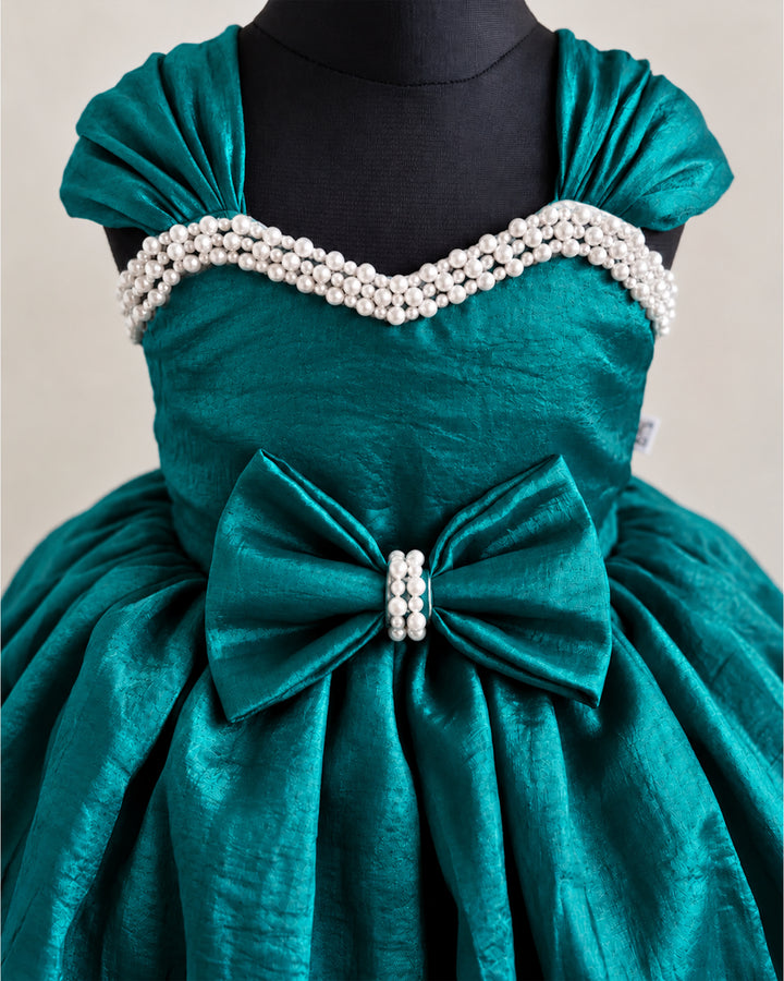 Close-up of intricate pearl embroidery on the yoke of a peacock green premium silk party frock , Stanwells kids