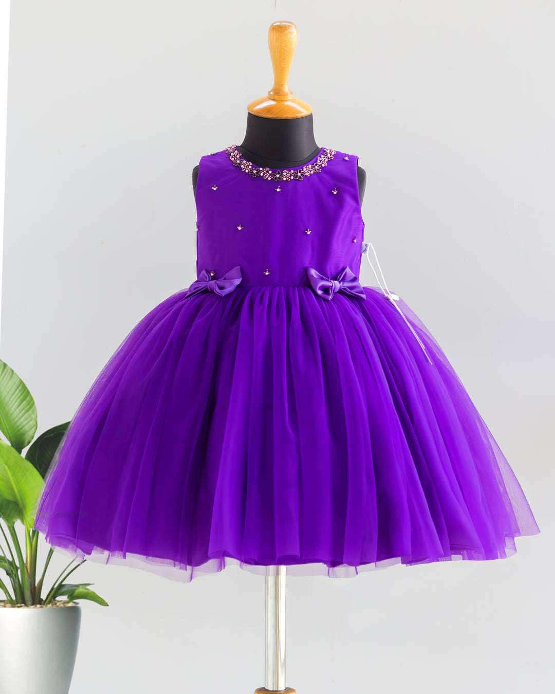 Violet shade handwork bow frock for baby girl – front view, Stanwells Kids