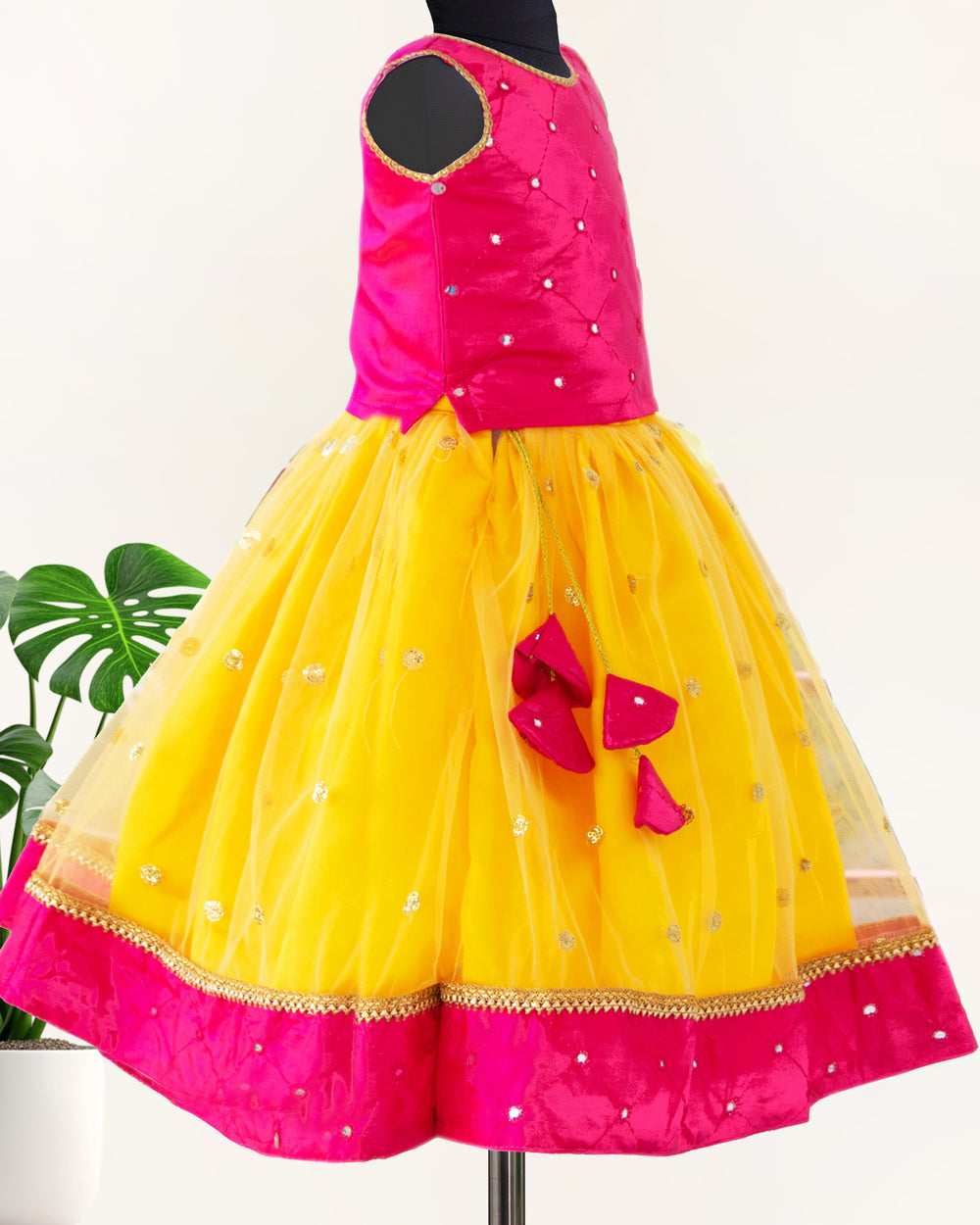 Yellow and magenta mirror work lehenga choli for baby girls

South Indian traditional birthday dress for girls

Mirror work festive wear lehenga choli

Baby girls ethnic partywear dress

Designer lehenga choli set for toddlers

Kids traditional outfit yellow magenta

Stanwells Kids festive birthday dress