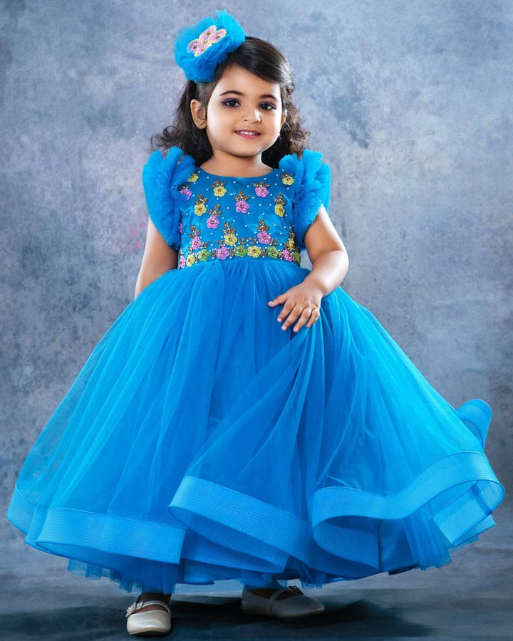Dark blue full length handwork gown - Matching Hairband
Material: Dark blue colour full length gown. In the yoke portion multi colour cut bead hand embroidery is given that give an elegant look to the gown. Two layer ple