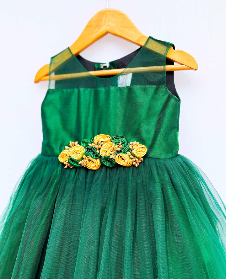 Bottle Green Knee-Length Flower Frock
Fabric:  Bottlle Green shade  mono net with green and golden mix flowers on the centre portion.  Neck is designed in Transparent pattern. Beautifully designed outfi