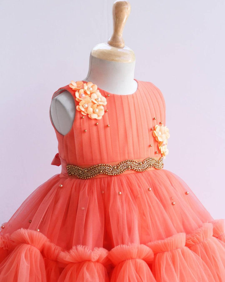 Coral Shade Pleated Ruffled Layer Frock
Material: Pleasent coral peach colour layered frock.Upper portion of the frock is done with pleated net and same colour. Cute flowers are attached on the both sides