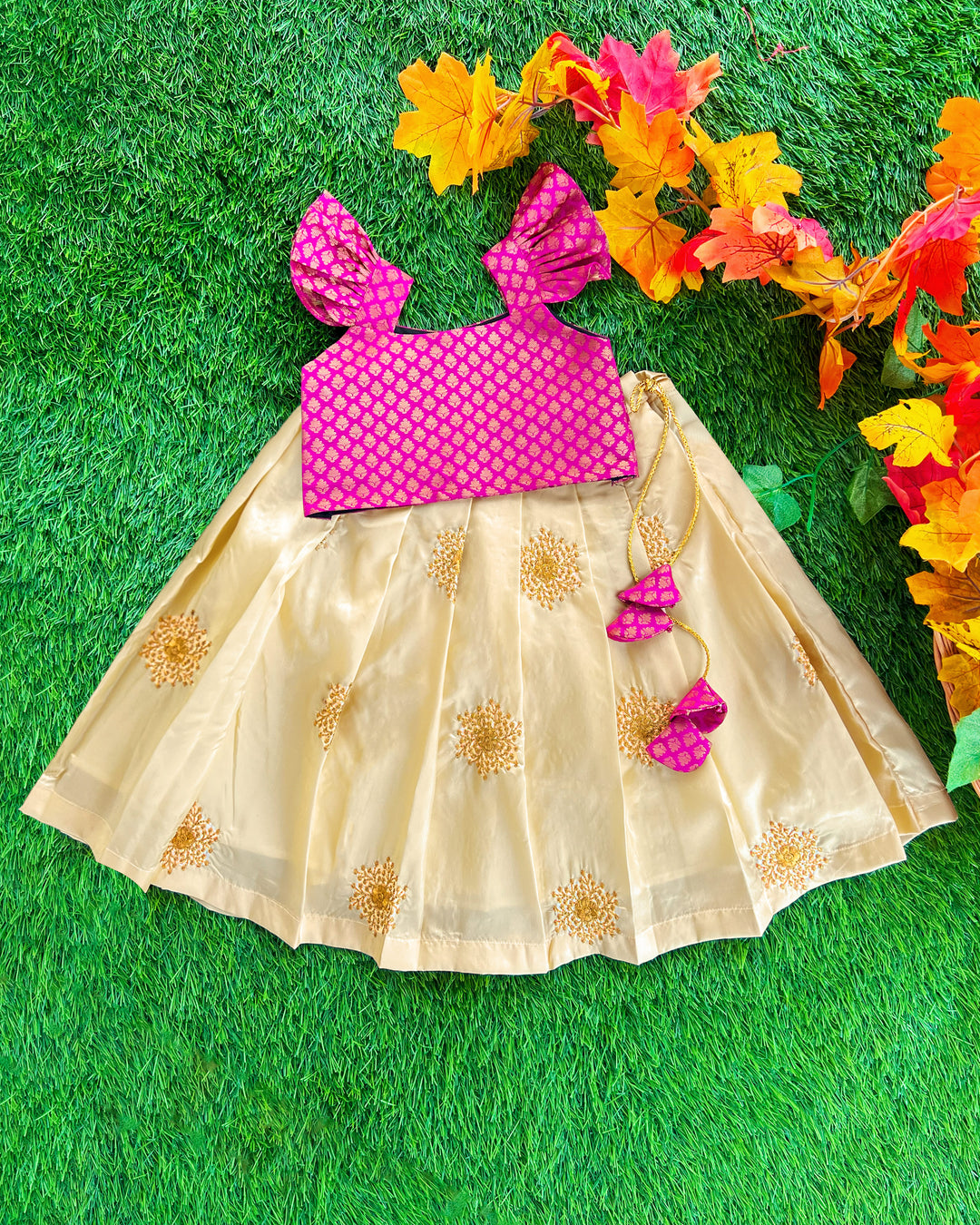 Baby girl in cream and magenta lehenga choli birthday and festive dress