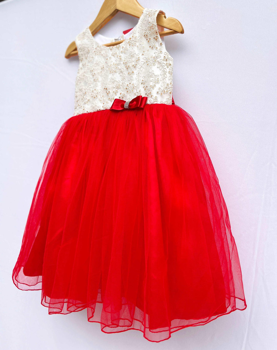 Red & Cream Combo Knee length Frock
Fabric: Red and Cream shade mono net with premium golden threadwork detailing on the yoke portion  Beautifully designed outfit for Baby girls with smooth lining for