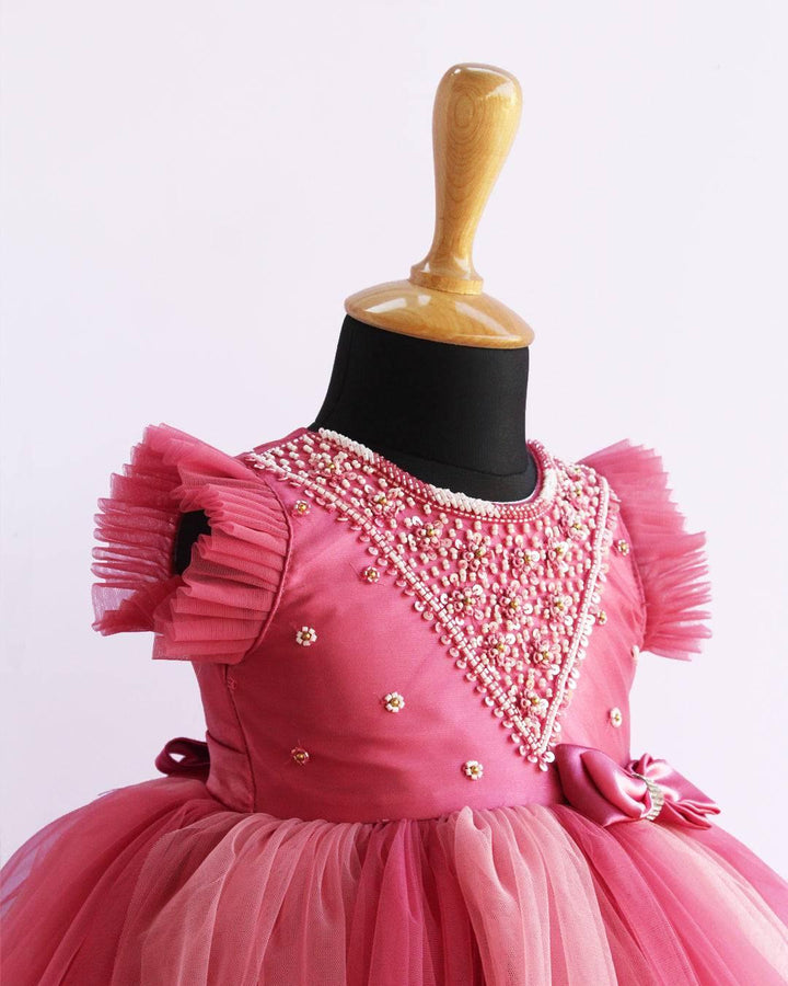 Blush Pink Handwork Layered Party wear Bow Frock
Material: Blush Pink and Baby Pink colour nylon net material is used in the yoke portion with Heavy quality ultra satin as the primary lining .This satin lining giv