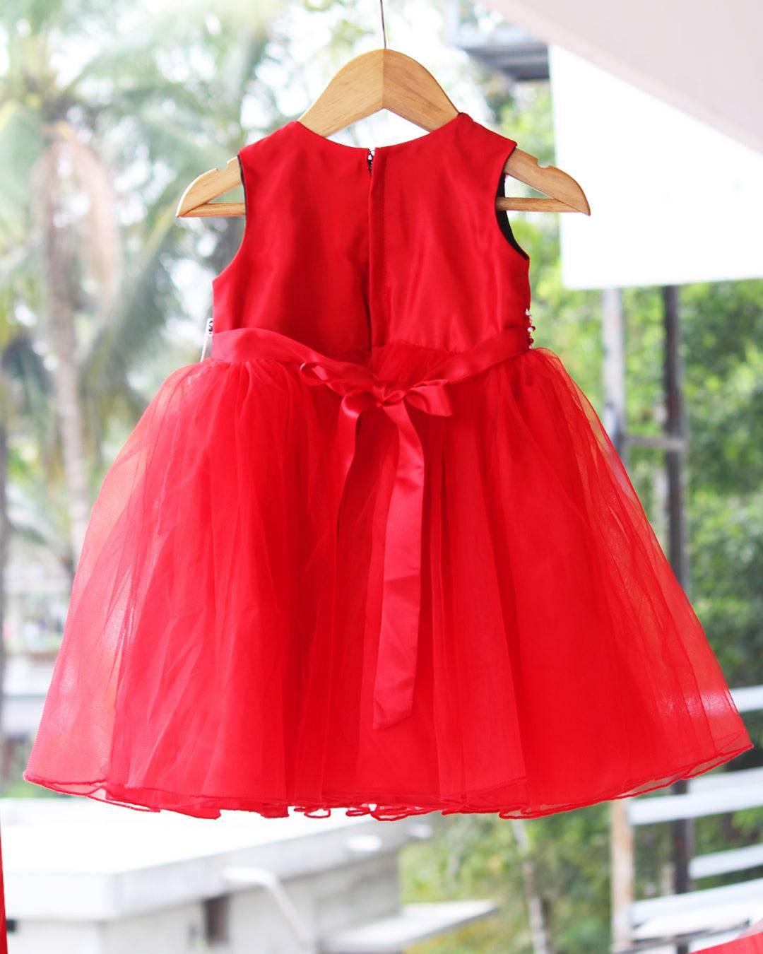Red Christmas Theme Handwork Pearl Frock.
Fabric: Bright Red mono net with premium same colour threadwork detailing on the yoke portion  Beautifully designed outfit for Baby girls with smooth lining for com