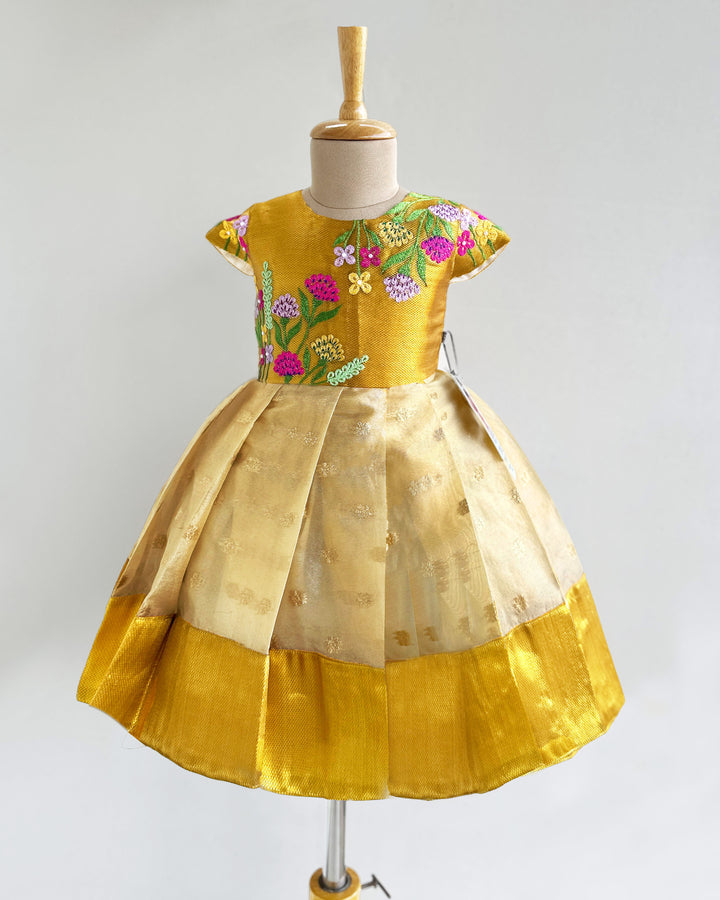 Golden silk birthday dress for baby girls with floral embroidery – Onam special frock

