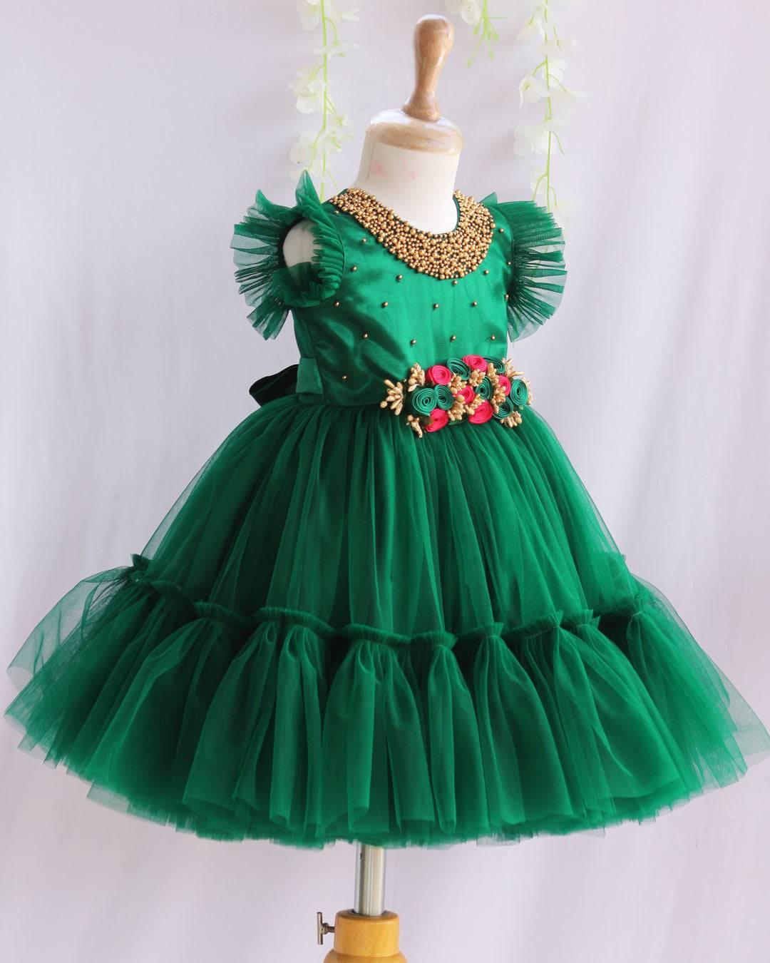 Bottle Green Shade Handwork Flower Frock
Material:  Bottle Green shade mono nylon net fabric with premium glossy satin as lining. Inner portion is covered with premium ultra satin and white cotton lining. 