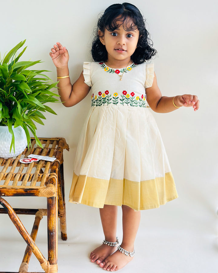 onam frock for girls, stanwells kids, ethnic dresses for girls, embroidery cotton frock for baby girls, kerala dresses, kasavu frocks, flower frocks kids 