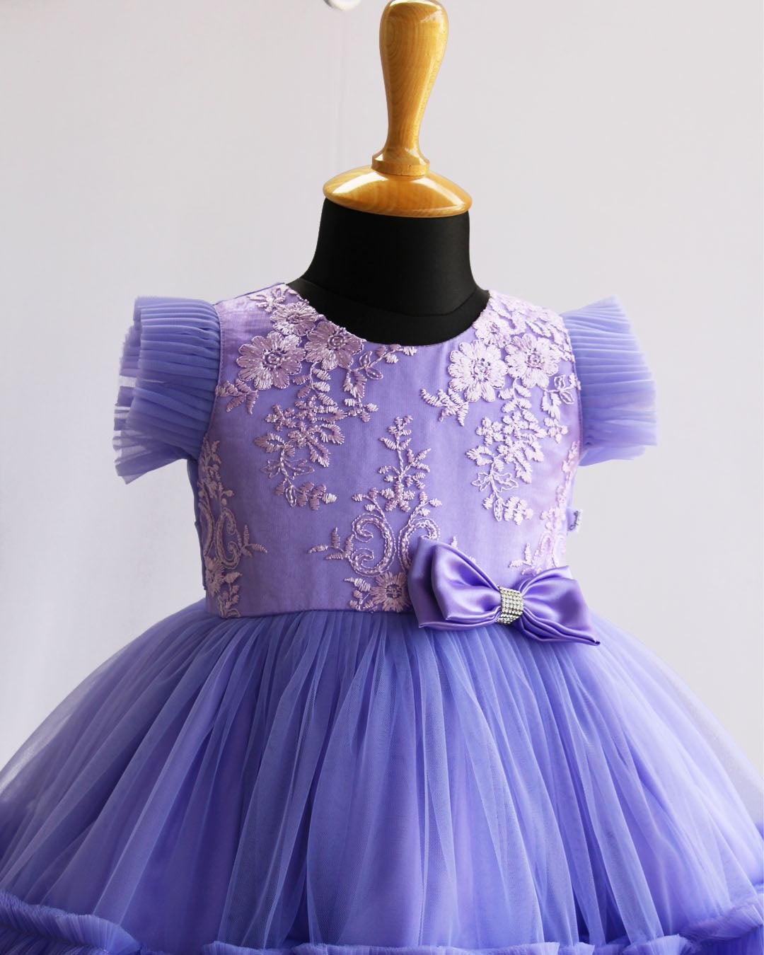 Lavender Shade Pleated Thread Embroidery Bow Frock
Material: : Lavender Shade Pleated Embroidery Bow Frock is made with soft mono nylon net fabrics with ruffled bottom. Heavy thread embroidered fabric is given in th