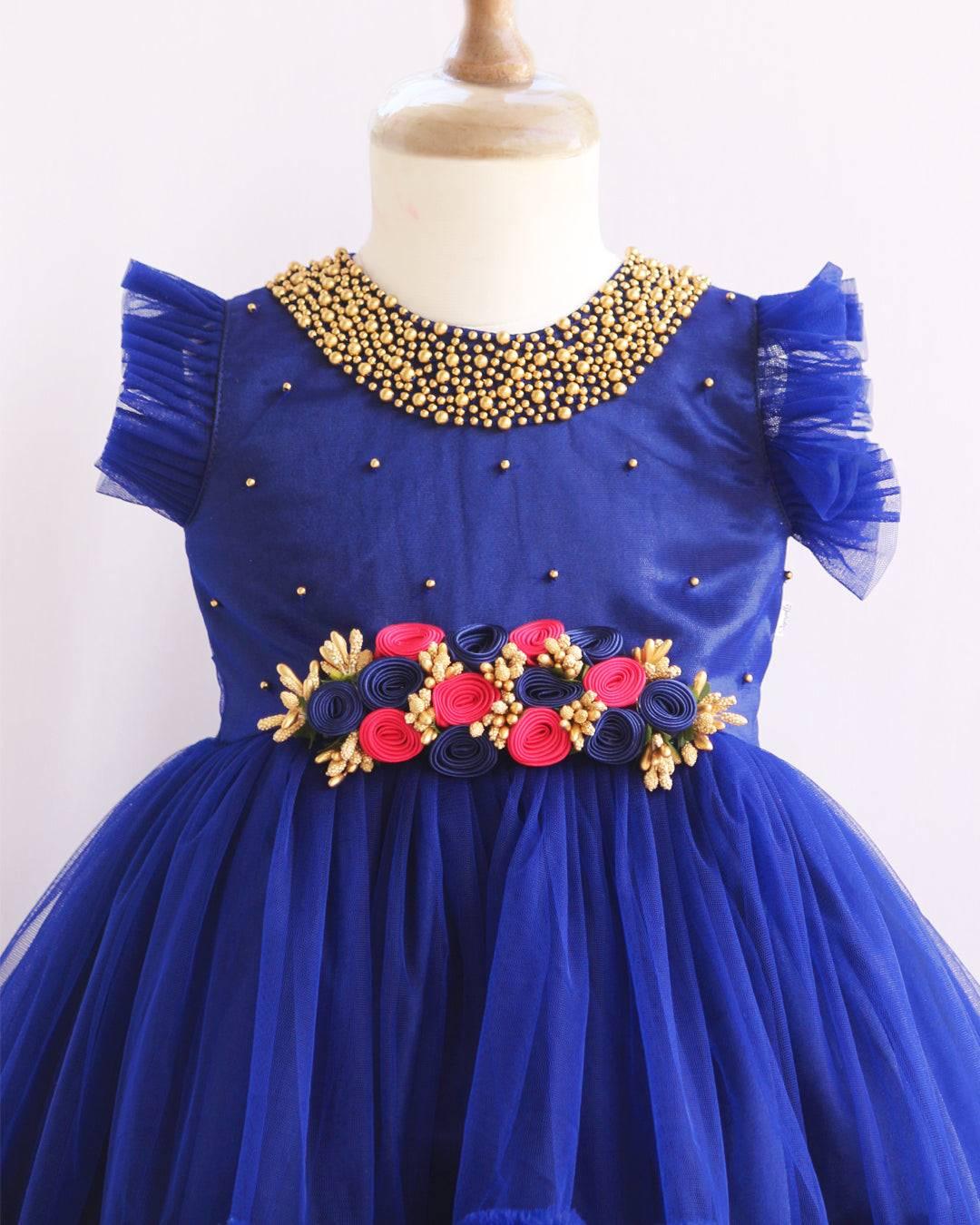 Navyblue Shade Handwork Flower Frock
Material:  Navy blue shade mono nylon net fabric with premium glossy satin as lining. Inner portion is covered with premium ultra satin and white cotton lining. Cen