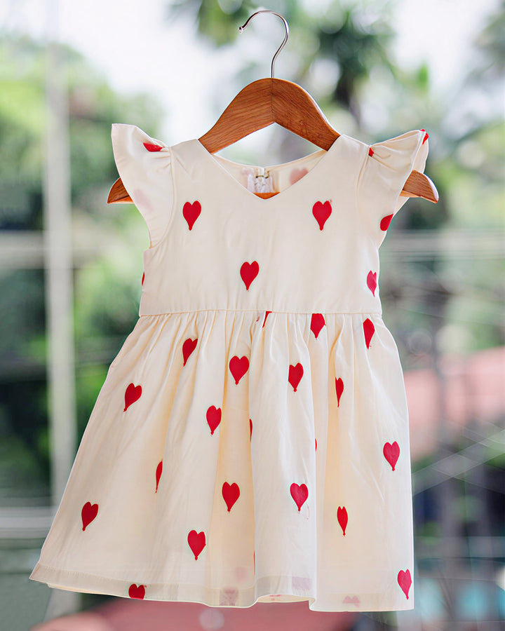 baby girls off white birthday dress

cotton birthday dress for baby girls

heart embroidery baby girl partywear dress

baby girls birthday party dress India

off white baby girl frock for birthday