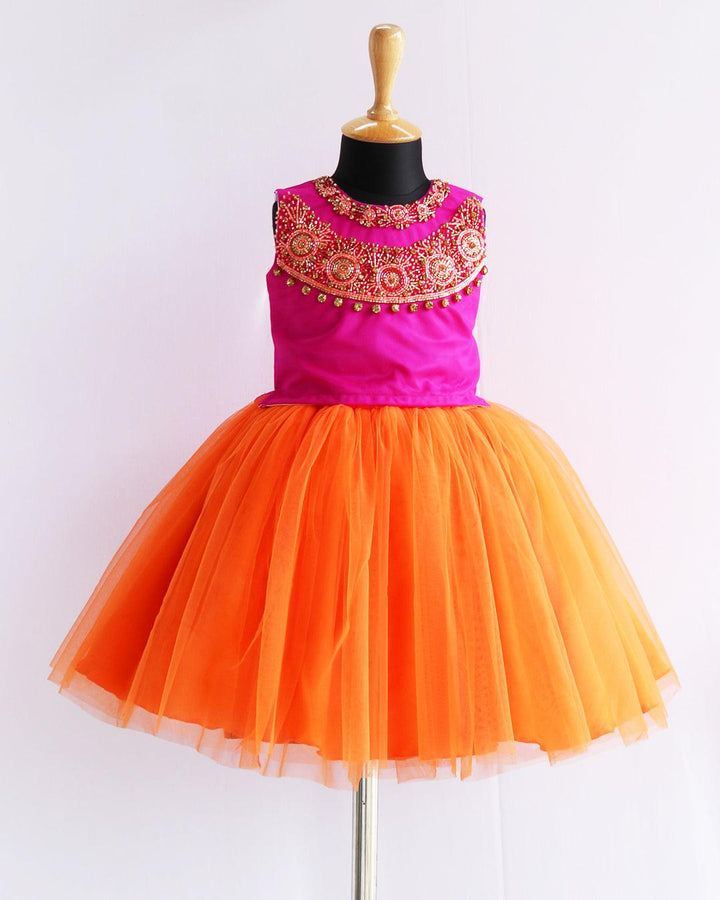 Orange & Magenta combo Heavy Handwork Skirt & Top
Material: Orange &amp; Magenta combo soft nylon net is used for making this beautiful skirt &amp; top .Top portion of the dress is designed with magenta colour net 