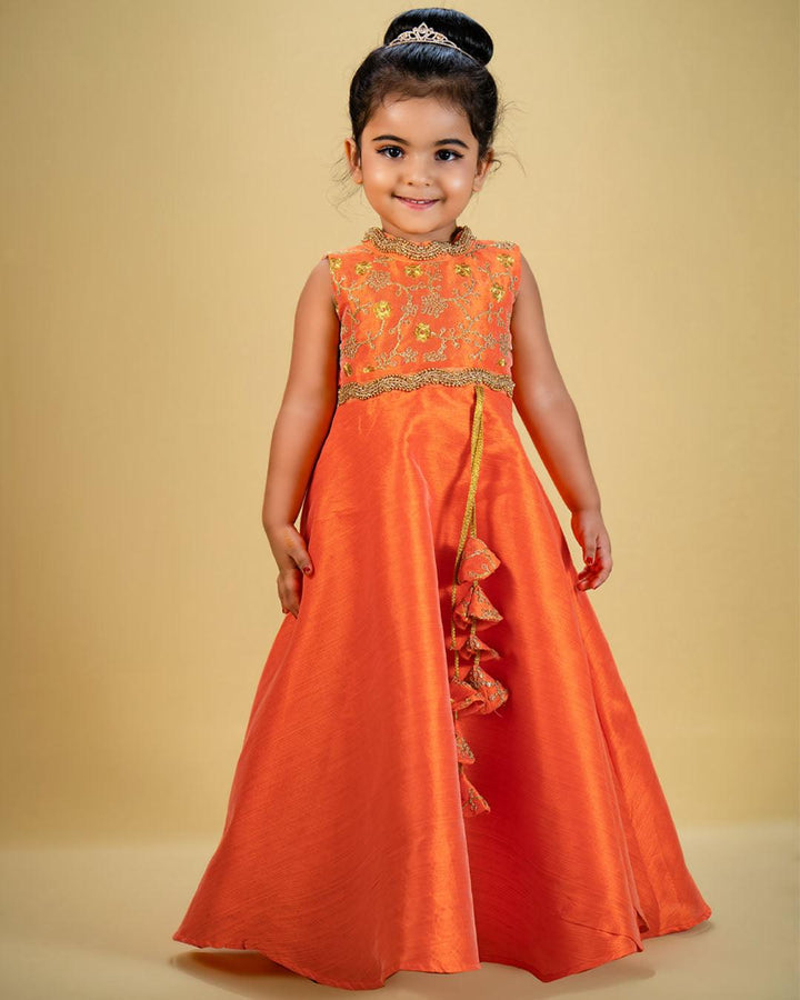 Orange Shade Halter Neck Embroidery Silk Long Gown 

Material: Orange shade halter neck embroidery silk gown is made with fantom blended silk fabrics with flared circle bottom. Heavy silk thread embroidered fabric i