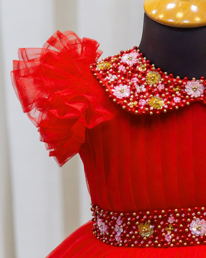 Red handwork party frock for girls with pleated bodice design