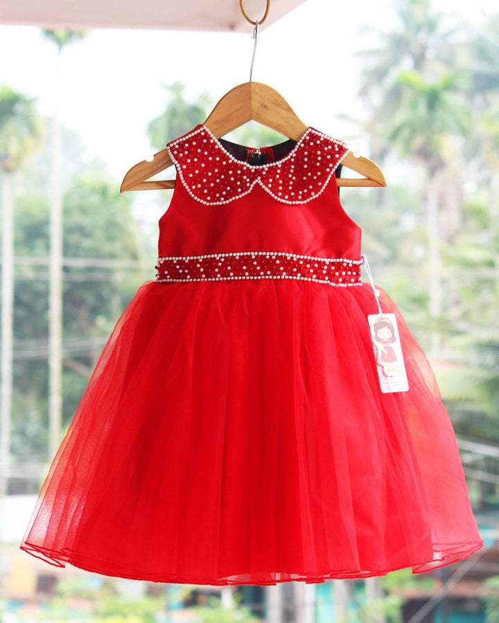 Red Christmas Theme Handwork Pearl Frock.
Fabric: Bright Red mono net with premium same colour threadwork detailing on the yoke portion  Beautifully designed outfit for Baby girls with smooth lining for com