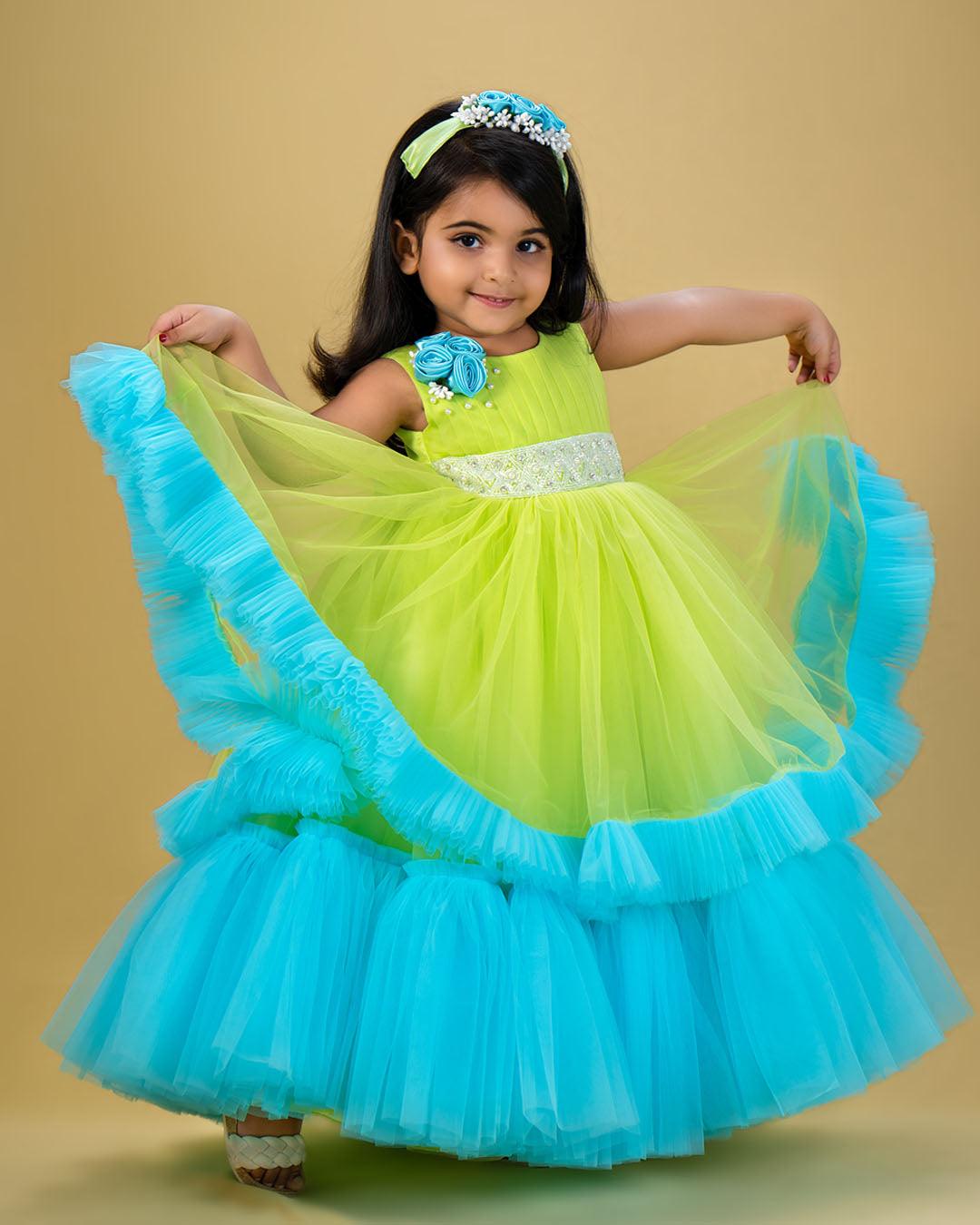 Lime Green & Skyblue Combo Pleated Ruffles Gown - Matching Hair Band
Material : Pista Green and Sky Blue combination gown. Yoke portion is done by pleated pista green net and premium quality satin is used for the primary lining. Shou