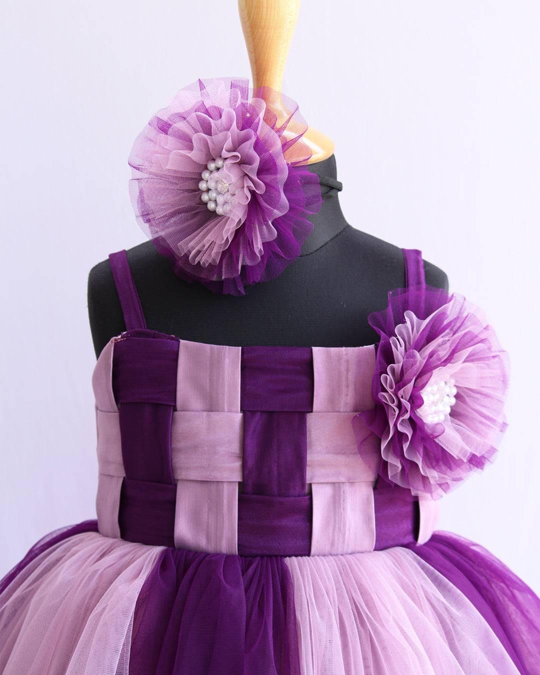 Purple & Pastel Pink Double Shade Layered Frock
Material: Purple and Pastel pink nylon net is used as in the skirt and yoke part of the dress. In the yoke portion two colours are given in a weaving pattern for an