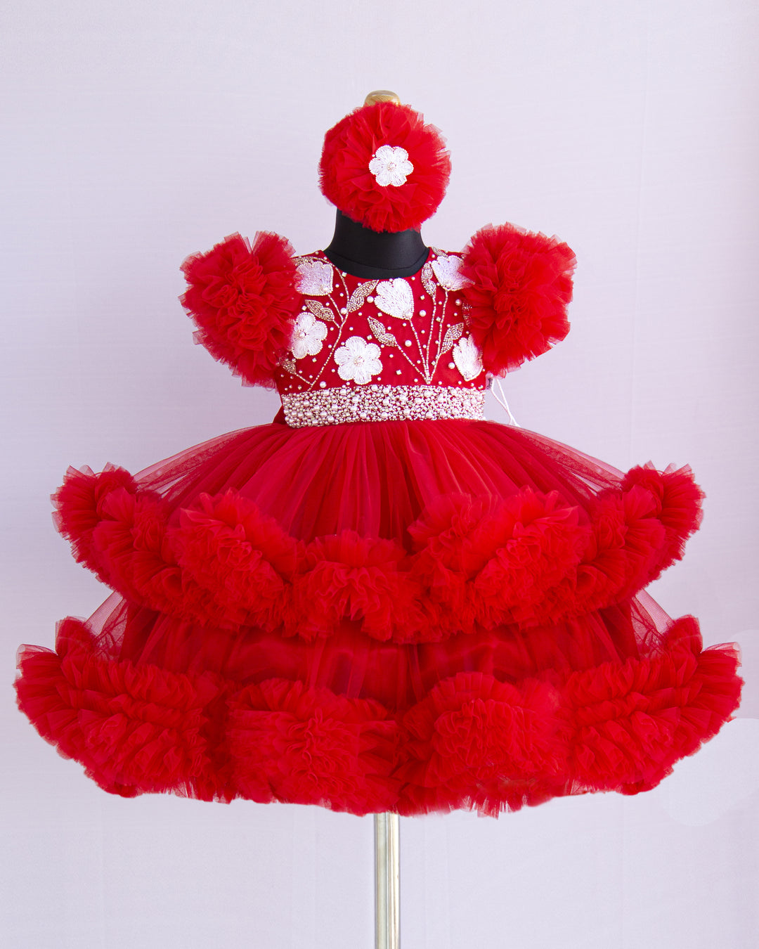 Red Shade Handwork Heavy Ruffles Baby-Girls Partywear Frock
Material: Red shade handwork baby-girls step frock is made with soft mono nylon net fabric. Yoke part is designed with white flower and beads handwork. White pearls