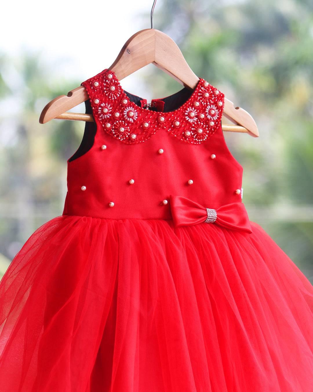 Red Colour Hand Embroidery Knee-Length Frock.
Material: Red colour soft quality nylon net fabric with premium matching ultra satin material is used for glossy feel.Yoke portion of the frock is designed with Whi